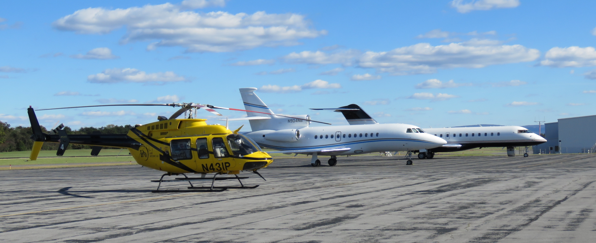 Helicopter and Jets staged on runway