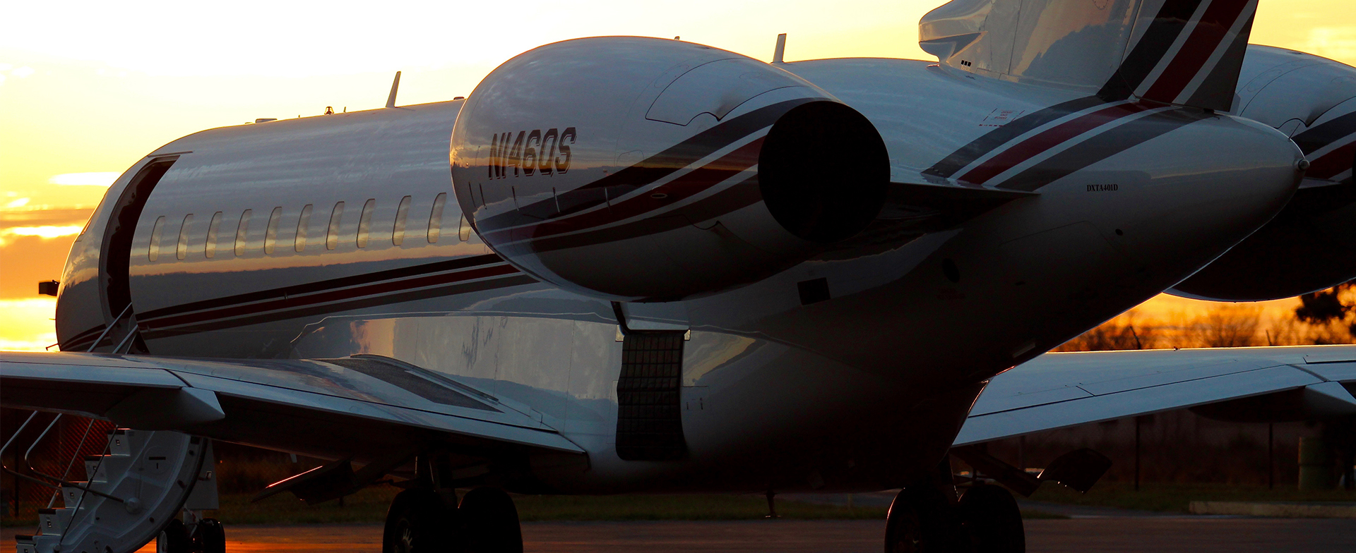 Business Jet on the runway at sunset